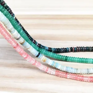 Detailed macro view of 2x6mm natural crystal and agate abacus beads for DIY jewelry