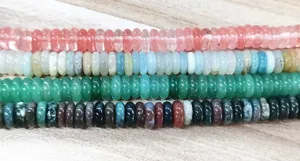 Macro detail of 2x6mm natural flat abacus beads in multiple colors for DIY jewelry