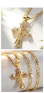 Detailed macro views showing elegant gold religious cross pendant and Figaro chain necklace