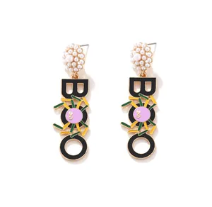 Detailed view of Halloween BOO dangle earrings with spider motif and pearl studs