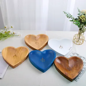 Set of multi-colored handcrafted heart-shaped wooden prayer bowls for home decor