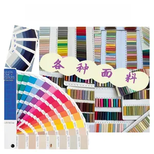 Detailed view of various fabric material swatches and professional color guides for caps