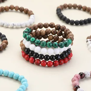 Stack of colorful natural stone beaded bracelets with wood and lava stone accents