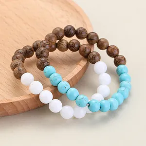 Close-up of beaded bracelets featuring wooden beads and natural turquoise stones