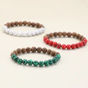 Three mixed color natural stone and wood beaded bracelets in green, red, and white