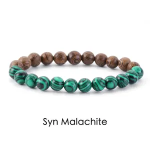 Detail view of synthetic malachite and wood bead bracelet with striped texture