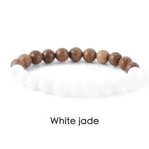 Detail of natural white jade and wood bead bracelet for meditation and daily style.