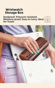 Portable brown leather watch roll case being placed into a white handbag for travel use