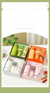 Close-up details of a colorful gift set including a portable fan, umbrella, and water bottle