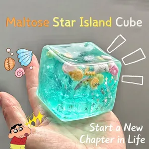 Macro detail of translucent blue ocean-themed ice cube squishy toy with shells and stars