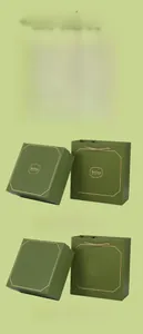 Dark green paper gift box and carry bag set with customizable gold stamped logo detail