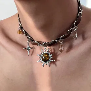 Brown leather sun and star charm choker necklace in a trendy Y2K hip-hop style