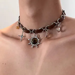 Vintage Y2K brown leather choker necklace with sun, moon, and star charms for women