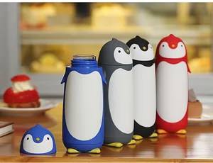 Penguin-shaped double-layer glass water bottles with colorful silicone sleeves.