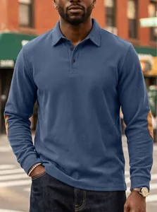 Men's blue ribbed corduroy polo shirt with brown elbow patches and button collar