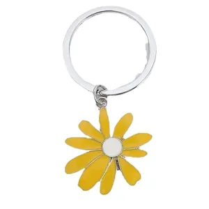 Yellow sunflower metal keychain accessory with white center on durable silver ring