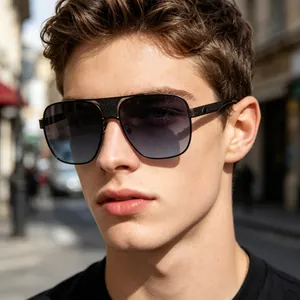 Close-up view of classic metal square sunglasses with gradient lenses worn by a male model.