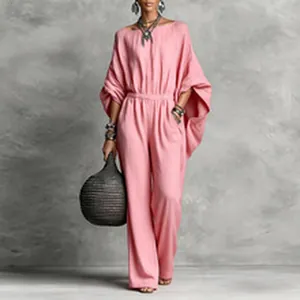 Detail view of elegant pink wide-leg jumpsuit with stylish batwing sleeves for spring
