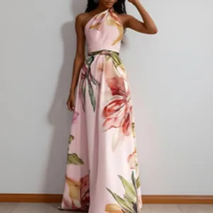 Detailed view of elegant pink halter neck maxi dress featuring large floral patterns