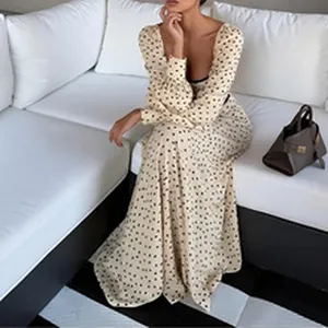 Elegant vintage style long sleeve polka dot maxi dress with square neckline shown on model