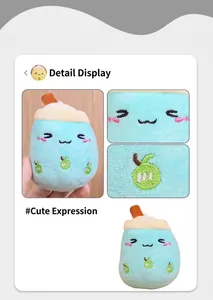 Close-up detail of a cute light blue bubble tea plush keychain with an embroidered face