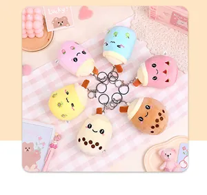 Detailed view of six colorful plush milk tea cup keychains featuring cute faces and charms