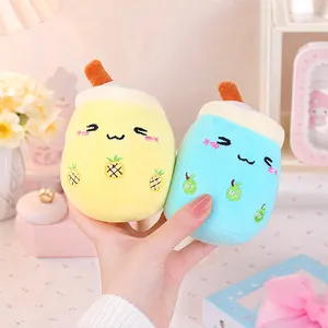 Two cute bubble tea plush keychains featuring adorable expressions and fruit motifs