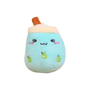 Adorable light blue plush milk tea cup keychain featuring an embroidered face and fruits