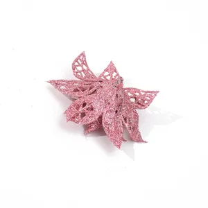 Close-up of pink glitter hollow poinsettia Christmas flower decoration for trees