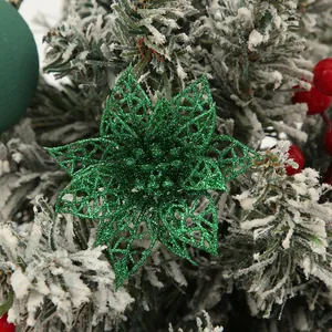 Close-up detail of a festive green glitter hollow-out poinsettia Christmas flower