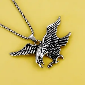 Men's stainless steel flying eagle pendant necklace with box chain on yellow background