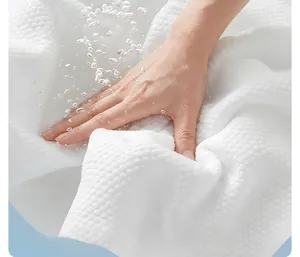Detail of white compressed disposable towel expanding instantly in water with large granules