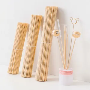 Detail showing various lengths of natural bamboo support sticks for DIY flower packaging.