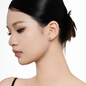Dainty S925 sterling silver star stud earrings with sparkling cubic zirconia on model