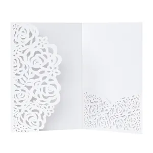 Detailed view of the elegant white laser-cut rose floral pattern on invitation card