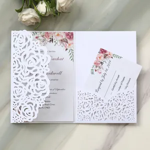 Elegant laser-cut white rose wedding invitation card with floral insert and RSVP detail