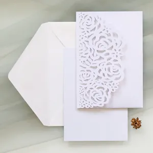 Elegant laser-cut rose invitation card set with white envelope and blank insert