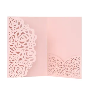 Detail of the elegant laser-cut rose pattern on flesh pink wedding invitation