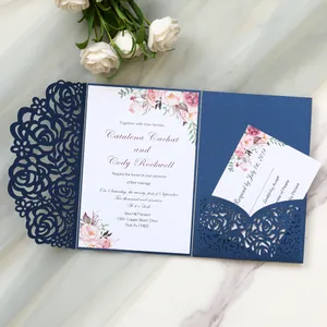 Detailed view of navy blue laser-cut rose wedding invitation card with floral insert