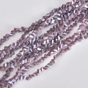Detailed view of 4mm faceted triangular purple glass beads for DIY jewelry making crafts