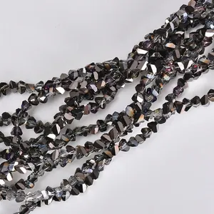 Macro view showing detailed texture of 4mm triangular electroplated glass beads for DIY jewelry