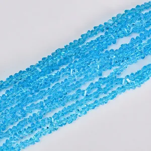 Macro view showing the texture of sky blue triangular faceted crystal beads for DIY