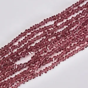 Macro view of 4mm dusty rose triangle crystal beads for jewelry making