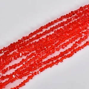 Macro shot of vibrant 4mm orange faceted triangle crystal beads for DIY jewelry