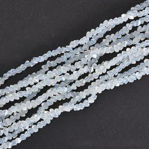 Close-up of 4mm triangular faceted iridescent glass beads for DIY jewelry making
