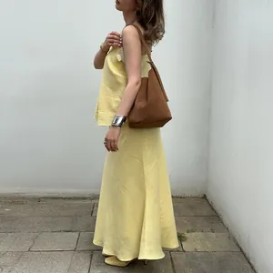 Elegant yellow sleeveless top and maxi skirt two-piece set for stylish summer outfits