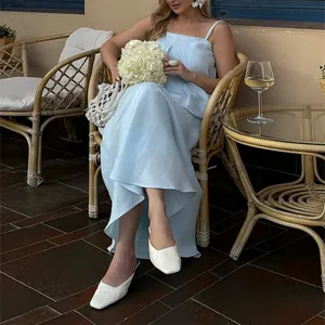 Elegant light blue summer camisole and long skirt set for women, chic outdoor style.