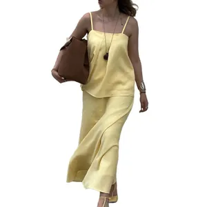 Elegant light yellow camisole top and matching maxi skirt two-piece set for women