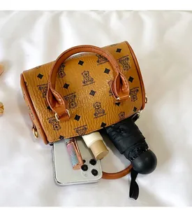 Detail view of the brown bear pattern handbag showing its large interior capacity