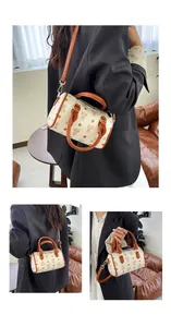 Mini barrel handbag with bear monogram print and adjustable shoulder strap for women